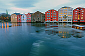 Colorful houses are reflected in the River Nidelva Bakklandet Trondheim Norway Europe