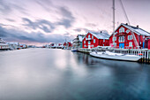 The typical fishing village of Henningsvaer with its red houses called rorbu Lofoten Islands Northern Norway Europe
