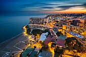 Panoramic landscape at dusk beaches, hotels and the Carihuela, Torremolinos. Malaga province Costa del Sol. Andalusia Southern Spain, Europe.