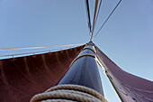 Directly below shot of  traditional German fishing sailboat against clear sky