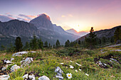 The sun rises behind Mount Cristallo, Cortina d'Ampezzo, Belluno district, Veneto, Italy, Europe