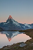 In Matterhorn is reflected in the lake at dawn Stelllisee, Zermatt valley, Valais-Wallis Canton, Switzerland