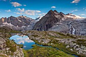 Genova valley, Adamelllo-Brenta natural park, Trentino Alto Adige, Italy, One of the many small lakes that surround the Mandrone refuge, In backgroud there are the three Lobbie and a tongue of Adamello glacier