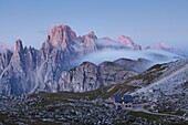 Tre Cime di lavaredo, Sexten Dolomites, Veneto, The refuge Lavaredo before the sunrise with Cadini of Misurina in background