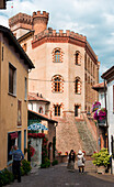 Italy, Piedmont, Cuneo district, Langhe, Barolo, Tourists photographing the streets of Barolo , at the foot of the castle