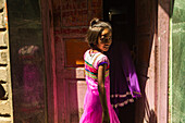 Varanasi, Uttar Pradesh, India, Asia, Girl entering house