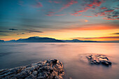 Manerba, Garda Lake, Brescia, Italy Sunrise on Lake Garda, in the locality Manerba, in front of Mount Baldo