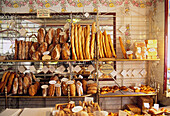 France, Paris, old bakery with breads and decorated with ceramics representing flower garlands