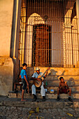 Caribbean, Cuba, Sancti Spiritus, Trinidad, Plaza Mayor, Iglesia Parroquial de la Santissima Trinidad and street musicians