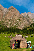 Kyrgyzstan, Issyk Kul Province (Ysyk-Kol), Juuku valley, Assil Adylbekova in front of her yourt