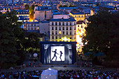 'France, Paris, 18th district. Montmartre. Outdoor cinema. Festival '' Cinema by moonlight '' organized by the Forum of the Images. July 31st, 2014: projection of the movie '' Du rififi chez les hommes '' by Jules Dassin'