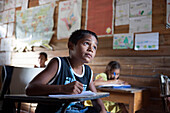 Brazil, Amapa, Child studying in the municipal primary school of the Araguari river