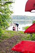canoe tour, holiday, summer, red boats, nature camping at Ellbogensee, lake, Strasen, Mecklenburg lakes, Mecklenburg lake district, Mecklenburg-West Pomerania, Germany, Europe