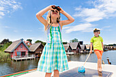 Girl and boy on boat, binocular, captain, children, houseboat tour, Lake Mirower See, Kuhnle-Tours, Mecklenburg lakes, Mecklenburg lake district, MR, Mirow, Mecklenburg-West Pomerania, Germany, Europe