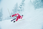 Santa Claus Fall Down While Skiing On Snowy Landscape