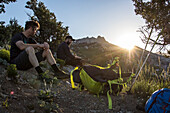 Two Hikers Takes A Break While Hiking Towards Utah's Lone Peak Located In The Wasatch Mountains