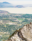A Person Climbing The Route On Lone Peak With Utah Lake And The City Of Provo Can Be Seen In The Distance
