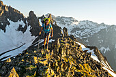 A Female Hiker Hiking On Blaine Peak Below Mount Sneffels In Colorado