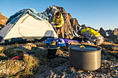 A Woman Preparing For Camping On Blaine Peak Below Mount Sneffels