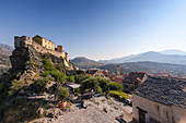 View of the old town of citadel of Corte perched on the hill surrounded by mountains, Haute-Corse, Corsica, France, Europe