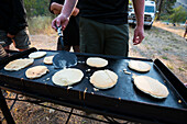Close-up Of Boys Preparing Pancakes During Camping In Orofino, Idaho