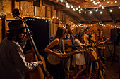Eric Jones (bass) performs with alt-folk orchestra Patchy Sanders at the Blue Barn in Boulder, Colorado.