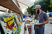 A man looks for the vintage goods, Havana, Cuba.