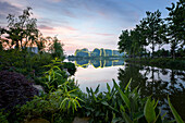 Baimahu Convention Center Park with architecture reflections and plants.