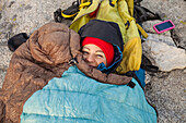 High Angle View Of Climber Relaxing On Rock