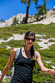 Young female hiker on the Five Lakes Trail in the Granite Chief Wilderness, Lake Tahoe