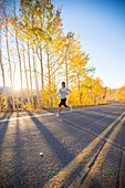 Woman Running On Street On Crisp Fall Day