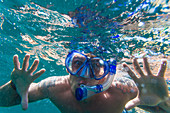 Portrait Of Man Snorkeling In The Ocean