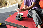 Close-up Of Male Climber Applying Chalk To Hands