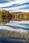 Reflection Of Autumn Trees In Lake Abanakee, New York, Usa