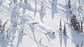 Male Skier Makes A Powder Turn At Whitefish Mountain Resort In Whitefish, Montana, Usa
