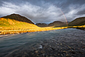 A Rainbow Arcs Over A River In The Landscape At Lake Clark National Park And Preserve, Alaska