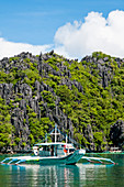 Boat Touring The Tropical Islands Of El Nido In The Philippines