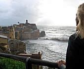 Woman on pormentory above sea