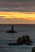Vieille lighthouse from Raz point at sunset,  Plogoff, Finistère, Brittany, France