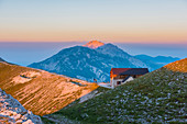 Italy, Abruzzo, Gran Sasso e Monti della Laga National Park, Sunset on Duca degli Abruzzi mountain hut