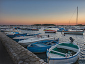 Italy, Puglia, Porto Cesareo, Harbor at sunset