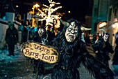 Mask and costume of monsters depicting half animal and half man during the Krampus run in Dobbiaco South Tyrol Italy Europe