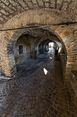 A typical alley and medieval walls of the old town of Corinaldo Province of Ancona Marche Italy Europe