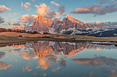 Sunset time in Alpe di Siusi, Sciliar-Catinaccio Nature Park, Trentino Alto Adige, Italy, surrounded by wide meadows and idyllic huts