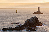 Vieille lighthouse from Raz point at sunset, Plogoff, Finistère, Brittany, France