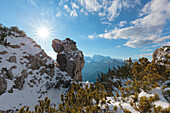 Europe, Italy, Veneto, Belluno, Agordino, Dolomites, Palazza Alta, Curious rock formation in the mountains between pristine snow and shrubs of mugo pine