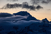 Disgrazia mountain at foggy sunset, Malenco valley, Lombardy, Italy