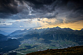 Sunset sky and dark clouds on the rocky peaks of Muottas Muragl St, Moritz Engadine Canton of Graubünden Switzerland Europe