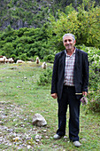 Shepherd with his flock of sheep, Theth, Albanian alps, Albania