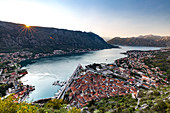 Looking over the old town of Kotor and across the Bay of Kotor viewed from the fortress at sunset, UNESCO World Heritage Site, Montenegro, Europe